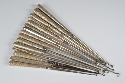 Lot 271 - A collection of fifteen silver handled button hooks