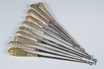 Lot 273 - A collection of ten silver handled button hooks