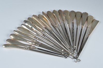 Lot 277 - A collection of twenty silver handled button hooks