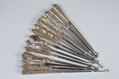 Lot 284 - Fourteen silver handled button hooks