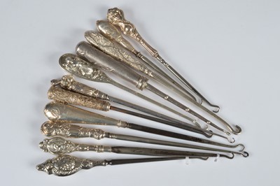 Lot 285 - Eleven figural handled button hooks