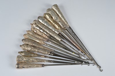 Lot 287 - Fourteen silver tapered handled button hooks