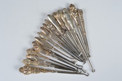 Lot 288 - Seventeen silver handled steel button hooks