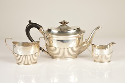 Lot 330 - An associated George V period silver three piece tea set