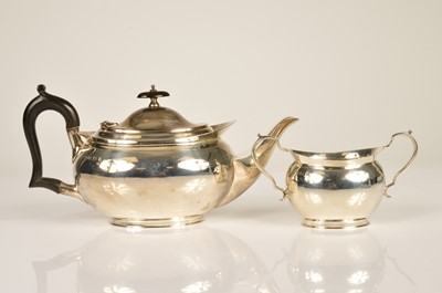 Lot 373 - A George V silver teapot and sugar basin by William Hutton and Sons