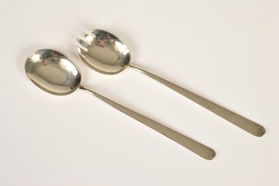Lot 386 - A pair of George V silver salad serving spoons by Hukin & Heath