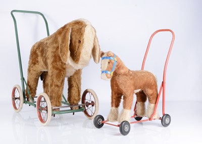 Lot 129 - Two ride on/push along horses