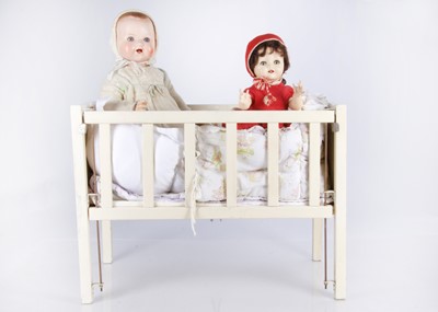 Lot 166 - A white wooden doll’s cot and large AW composition baby