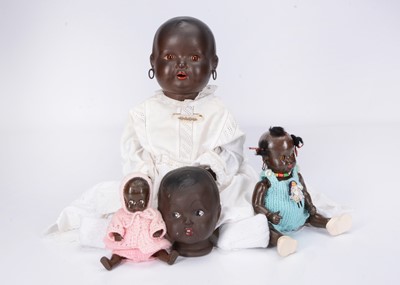 Lot 245 - Three black baby dolls