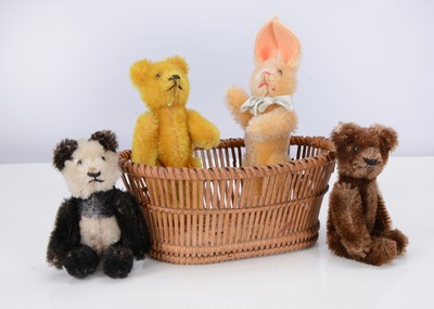 Lot 255 - Four post-war miniature Schuco teddy bears/ rabbit