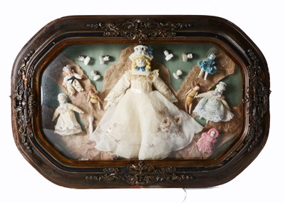 Lot 297 - A shadow box with assorted dolls