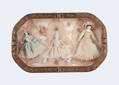 Lot 299 - A shadow box with assorted dolls