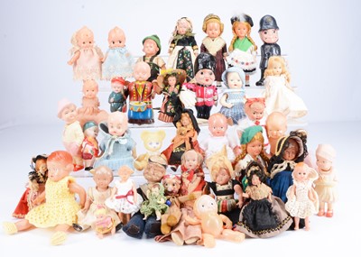 Lot 302 - A large selection of small plastic and celluloid dolls