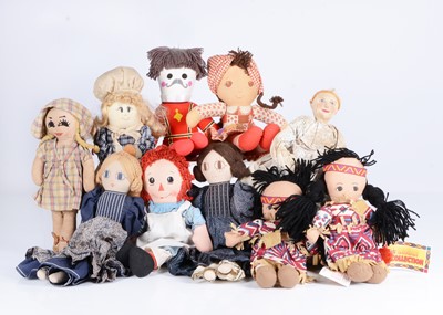Lot 328 - A large selection of cloth dolls