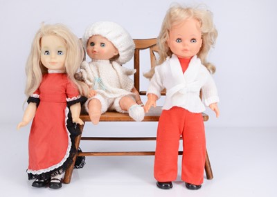 Lot 371 - Three vinyl and plastic dolls
