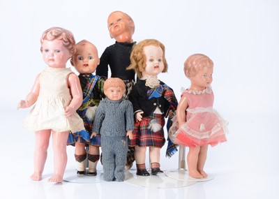 Lot 498 - Five celluloid and hard plastic dolls