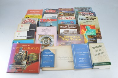 Lot 444 - Hardback and Softback Overseas Railway History books with Timetables and Toy Histories (25)