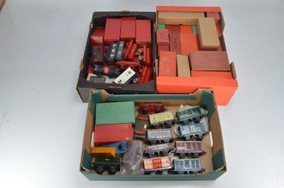 Lot 512 - Two boxes containing a qty of boxed and unboxed rolling stock and accessories including some early nut and bolt rolling stock (3 boxes)