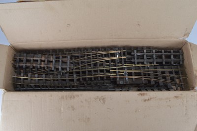 Lot 531 - A qty of Bassett Lowke or similar O Gauge 2 rail track and one piece of Gauge One 3 rail track with a small bag of fishplates and one buffer stop