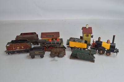 Lot 561 - Two O Gauge Locomotives with one cast iron floor train two tenders Hugar Goods building and one other (7)