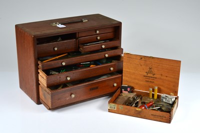 Lot 63 - A vintage Union wooden clock and watch repairers cabinet and contents