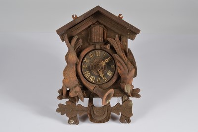 Lot 85 - A vintage Black Forest carved wooden cuckoo wall clock
