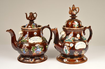 Lot 141 - A pair barge ware pottery teapots