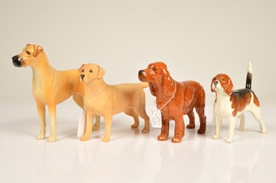 Lot 173 - Four Beswick Pottery dogs