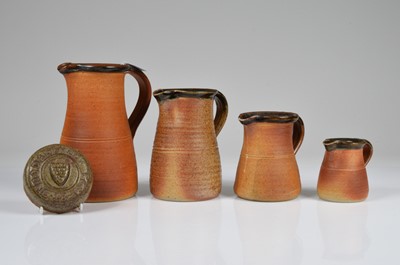 Lot 188 - A set of four graduated stoneware jug from the Muchelney Pottery