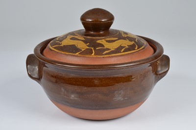 Lot 212 - A mid 20th century terracotta casserole dish