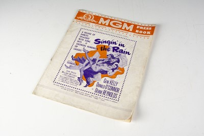 Lot 568 - Singin In The Rain Pressbook / Campaign Book