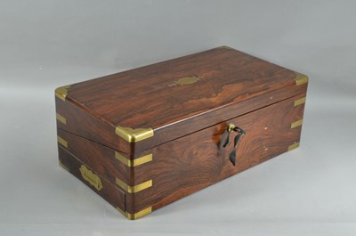 Lot 215 - A 19th century rosewood veneered and brass bounded campaign writing slope