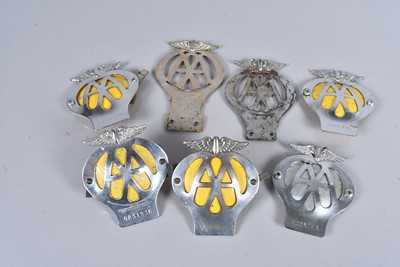 Lot 216 - A group of seven Automotive Association AA car badges