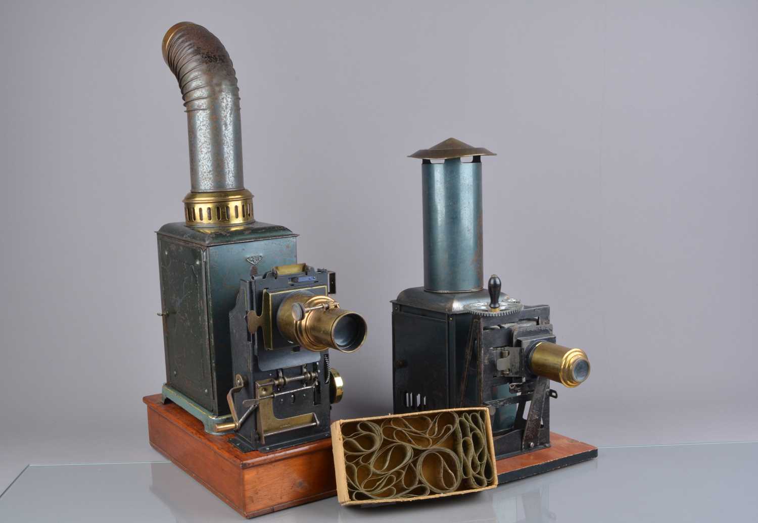 Lot 32 - Early 20th Century tinplate and lacquered brass 35mm Hand-Crank Projectors