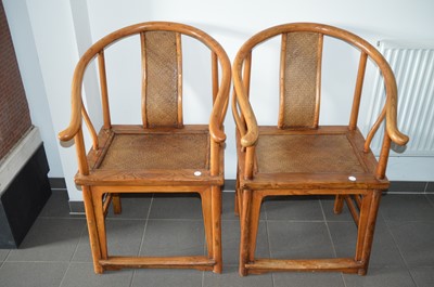 Lot 53 - A pair of late 19th century Chinese elm horseshoe back chairs