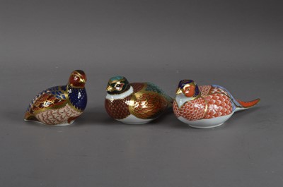Lot 179 - Three bird Royal Crown Derby bone china paperweights