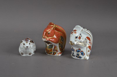 Lot 180 - Three Royal Crown Derby bone china paperweights