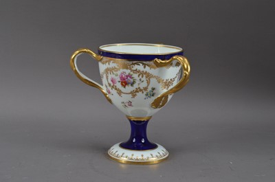 Lot 201 - A 20th century Cauldon porcelain footed tyg