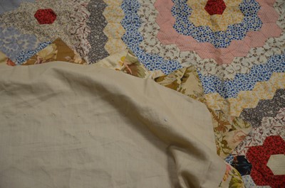 Lot 421 - An early 20th century patchwork quilt