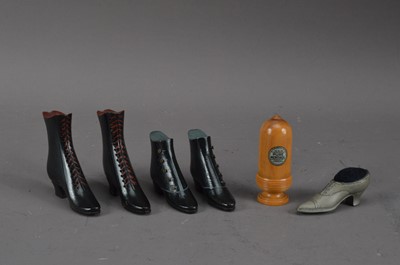 Lot 439 - Four ebonised wooden ladies shoes