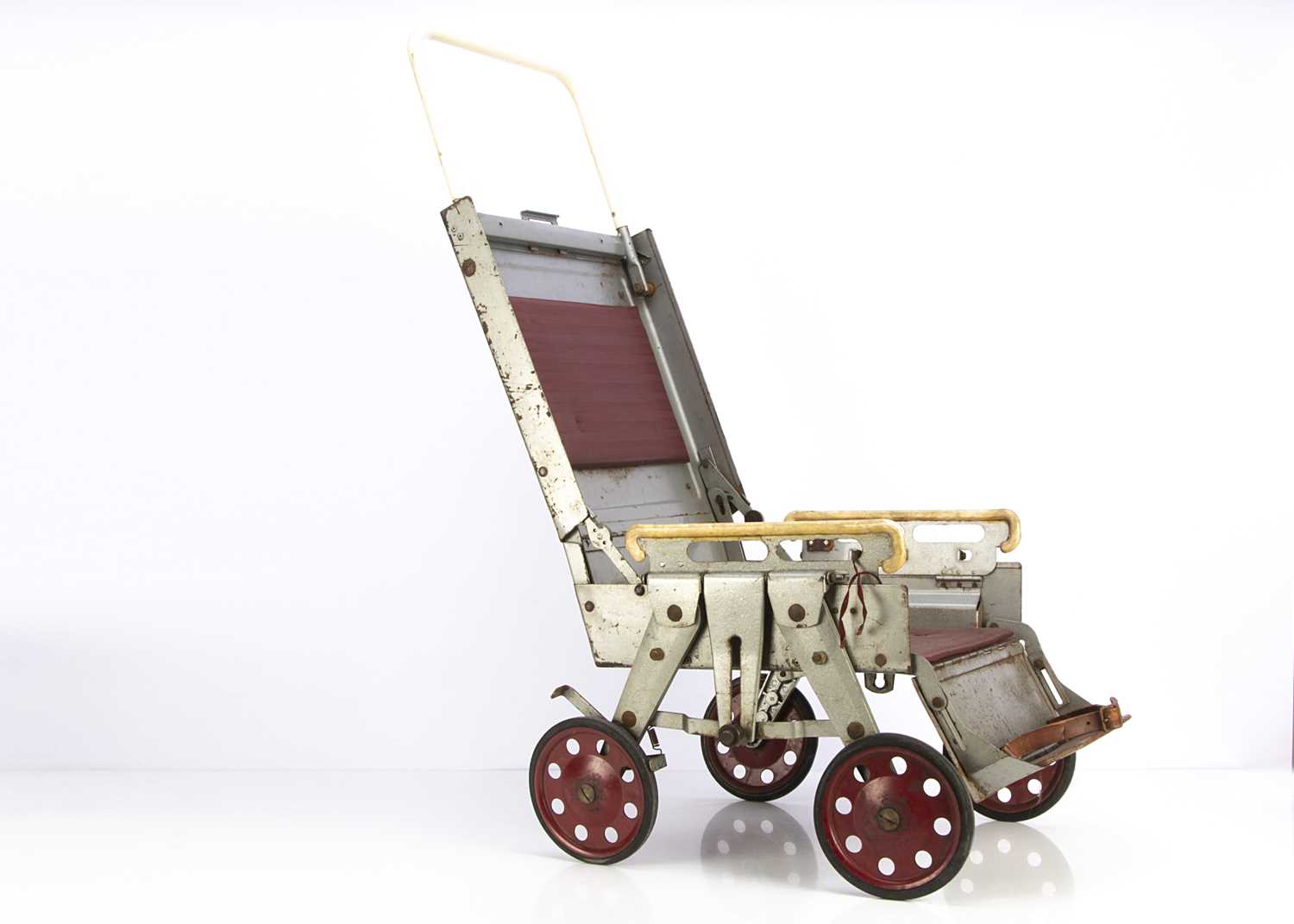 Lot 137 - A mid 20th century collapsible steel push chair
