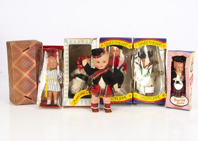 Lot 147 - Six clockwork dancing dolls