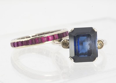 Lot 8 - A silver set blue and colourless paste three stone ring