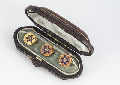 Lot 38 - A set of three gold, diamond and enamel circular dress studs