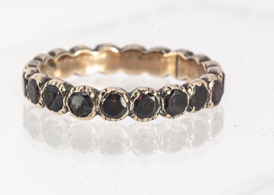 Lot 41 - A 19 century garnet full eternity ring