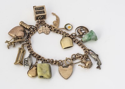 Lot 247 - A 9ct gold charm bracelet