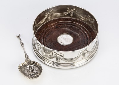 Lot 384 - A modern silver and wooden wine bottle coaster from B & Co