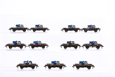 Lot 360 - Eleven Hornby-Dublo 00 Gauge 2-Rail unboxed flat wagons with Dublo Dinky Tractors