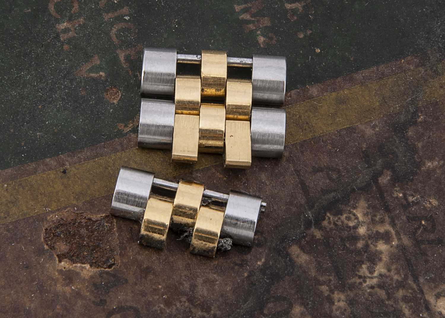 Lot 192 - Two c1970s Rolex Jubilee stainless steel and gold wristwatch bracelet links