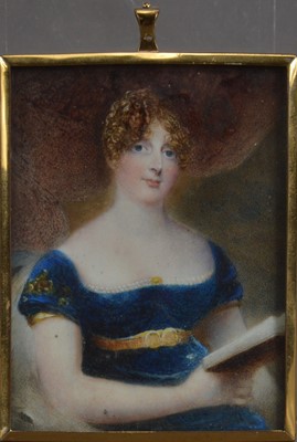 Lot 130 - A mid 19th century Portrait miniature on Ivory of a lady reading